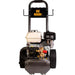 A commercial-grade pressure washer with a gasoline engine, featuring a black frame, gray tank, beige fuel container, and black wheels, shown against a plain white background.